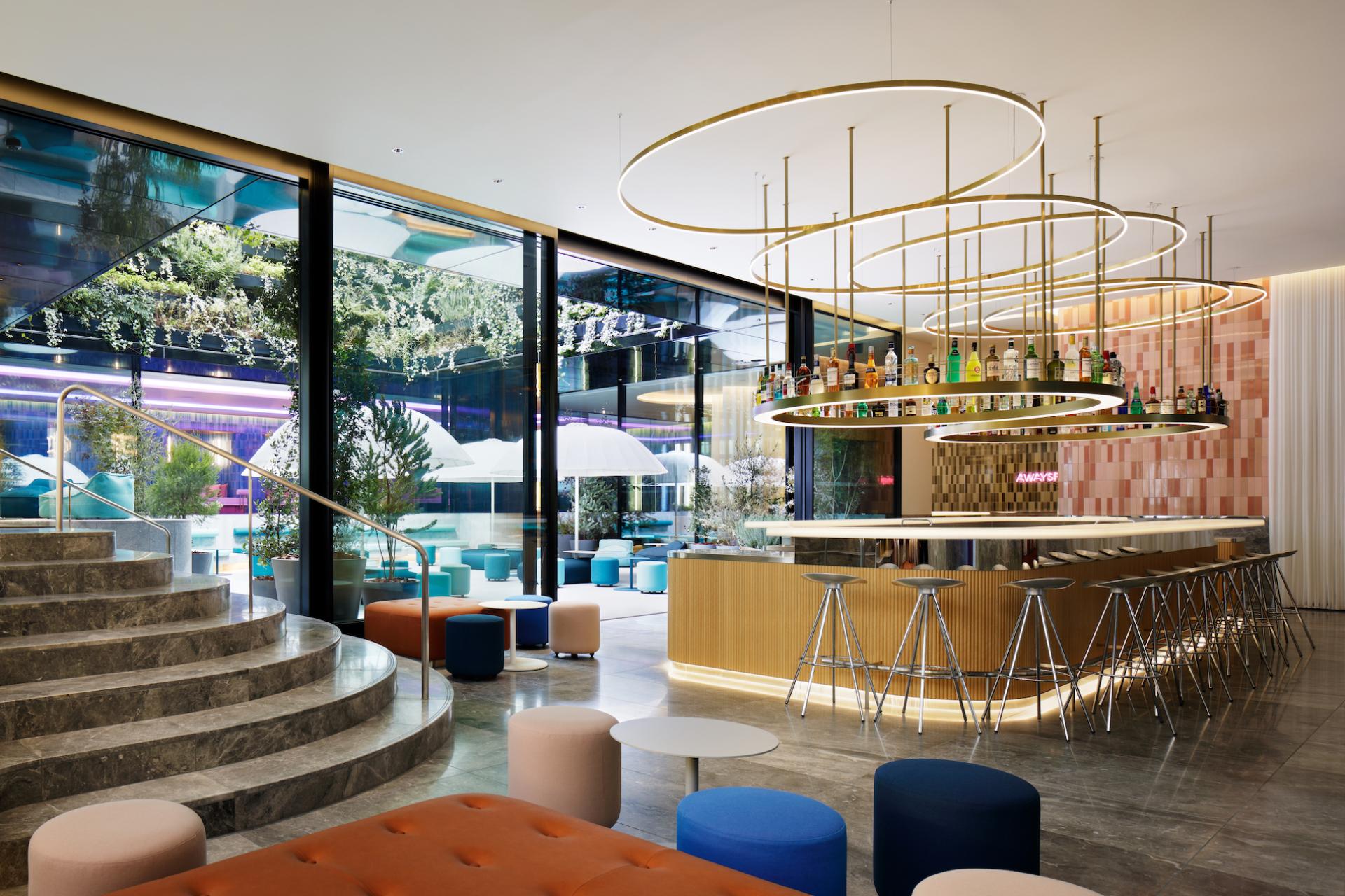 Stylish bar area in W Osaka featuring elegant seating, modern lighting, and a vibrant atmosphere for guests.