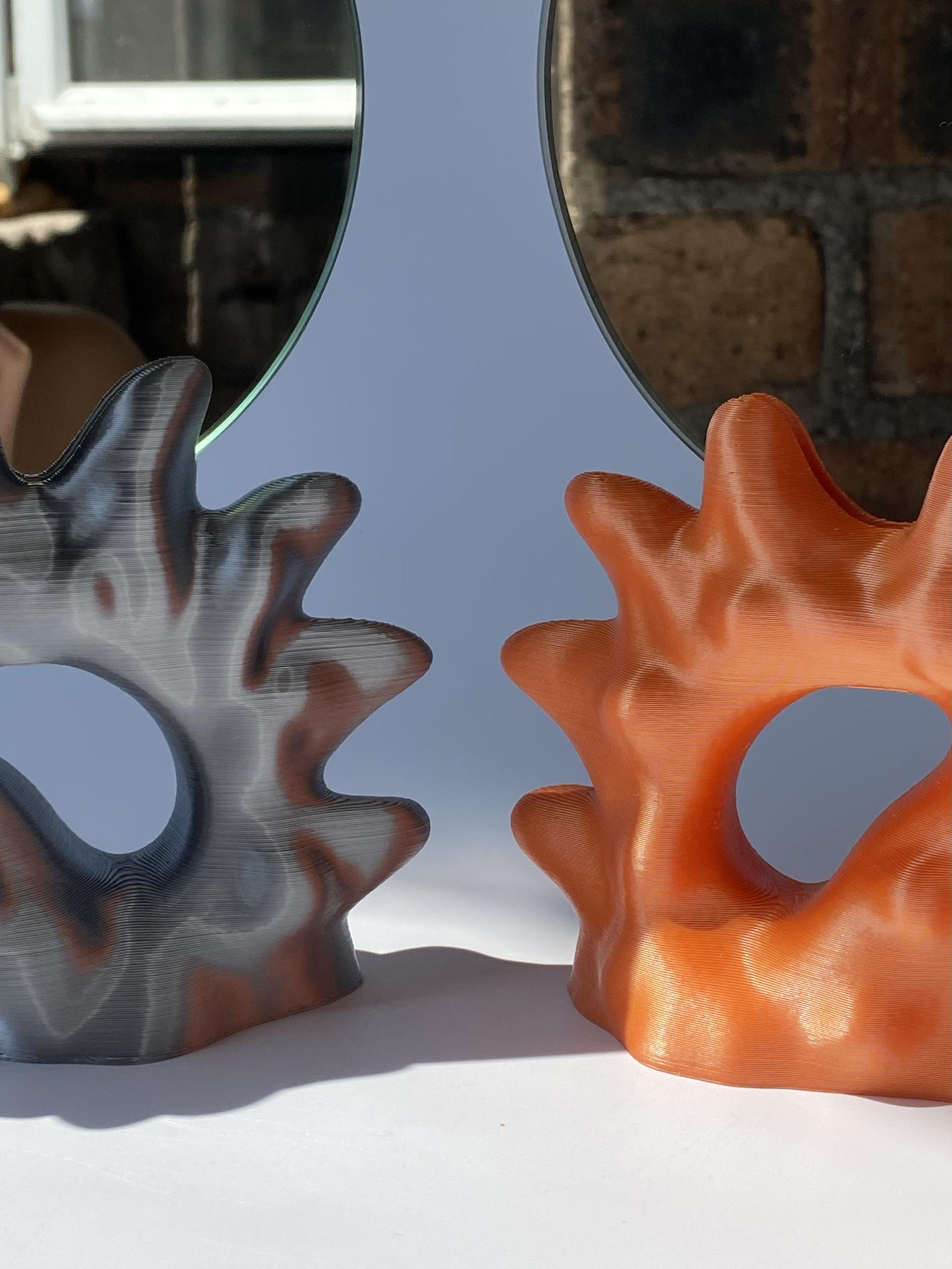 3D printed sculptures by Soorin Shin showcasing unique shapes and vibrant colors, reflecting contemporary art and design.