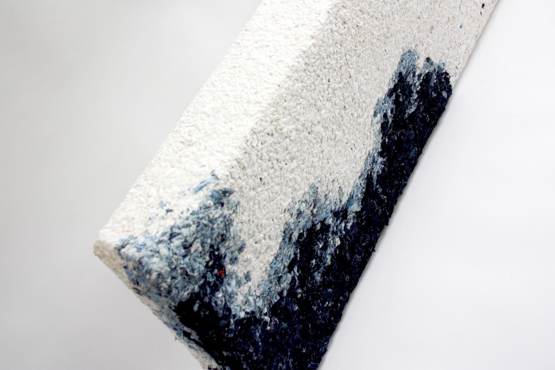 Innovative waste-based material showcasing a textured surface, highlighting regenerative design principles at the Material Matters Fair.