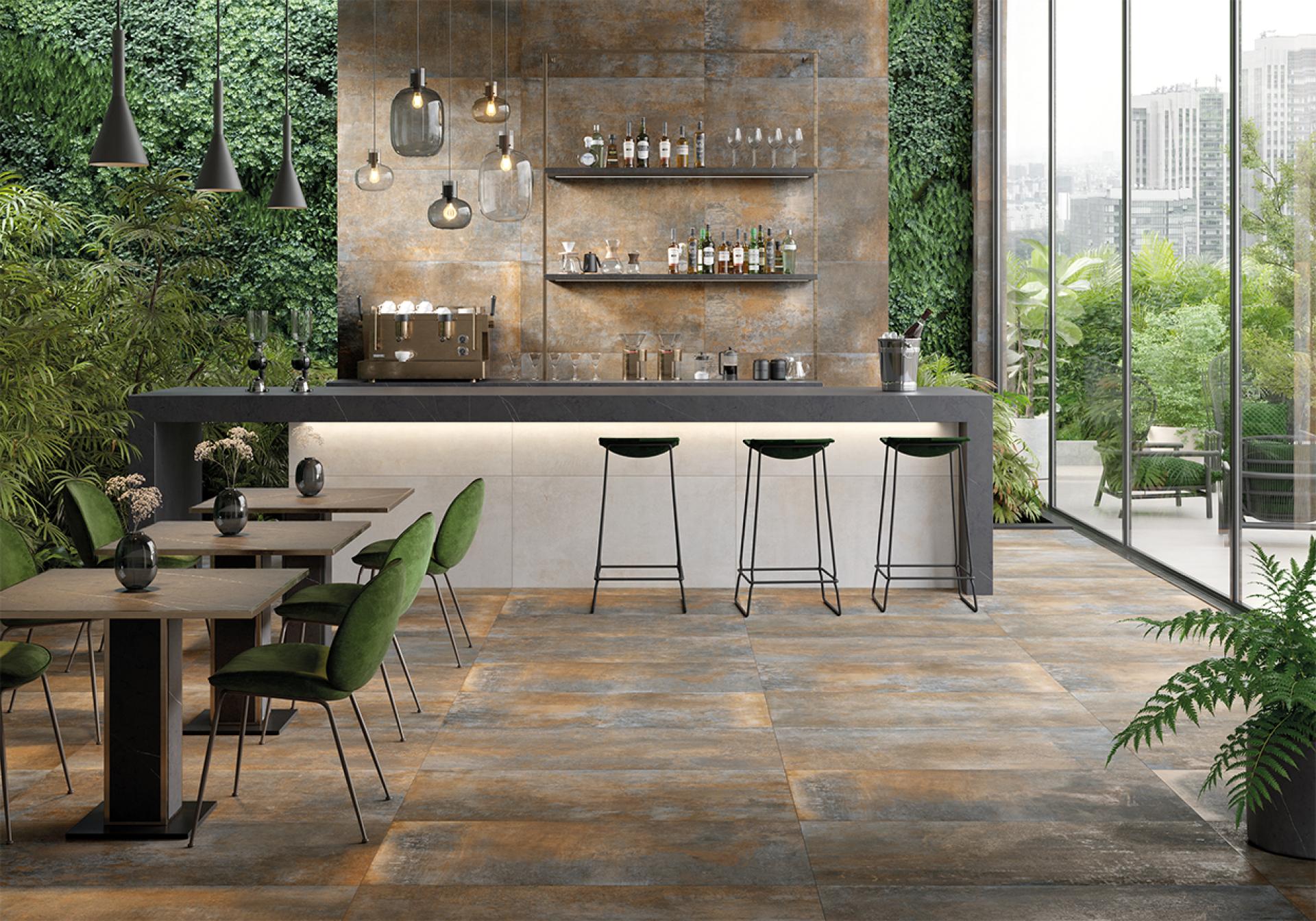 Stylish indoor bar area featuring modern tiles, green accents, and large glass windows bringing the outdoors in.