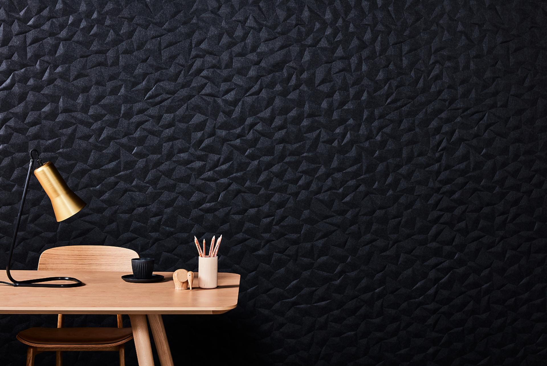 Textured black acoustic wall panel ION by Woven Image, enhancing interior design with Japanese-inspired aesthetics.