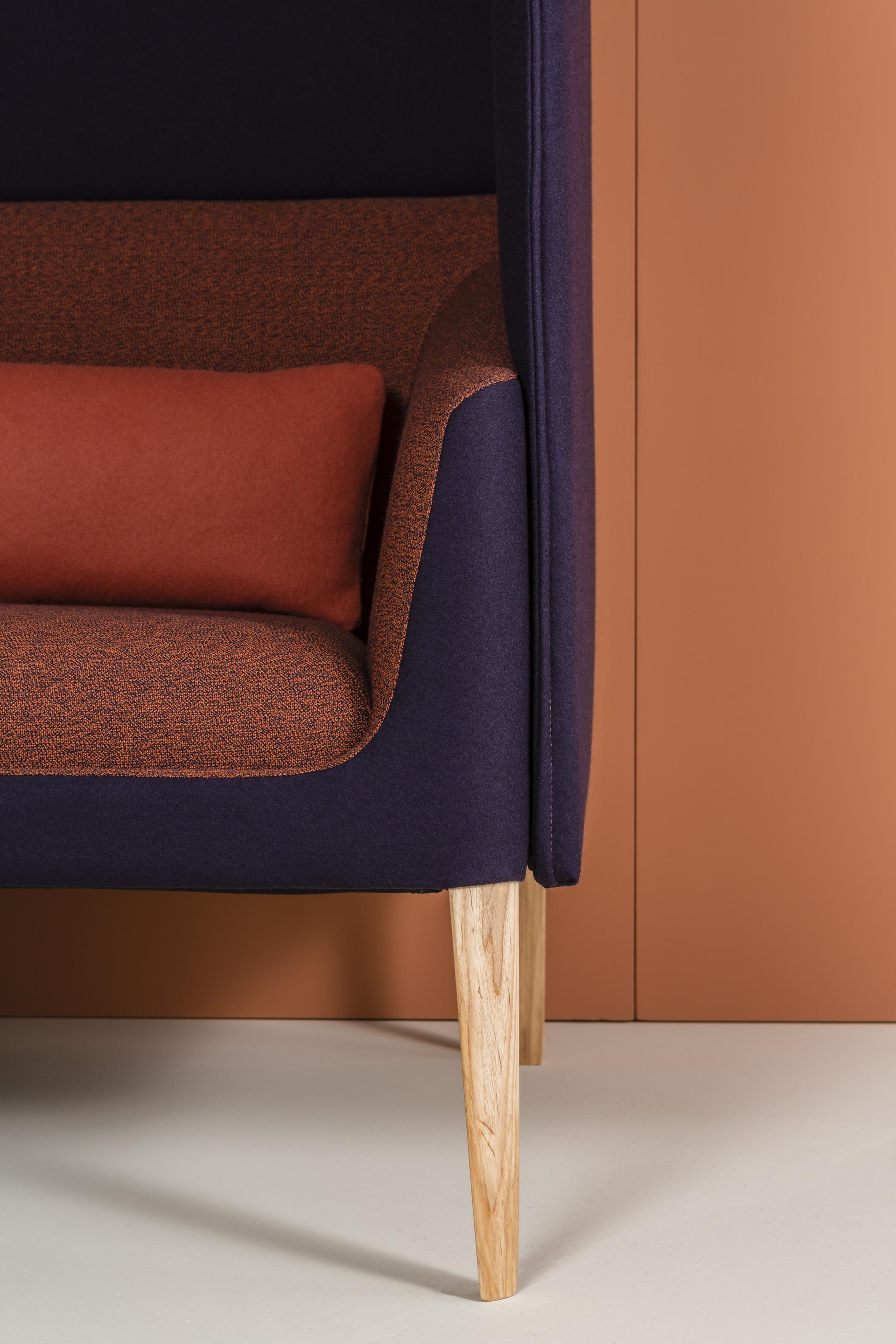 Stylish Kyoto collection armchair featuring vibrant purple and orange fabric with wooden legs, emphasizing comfort and modern design.