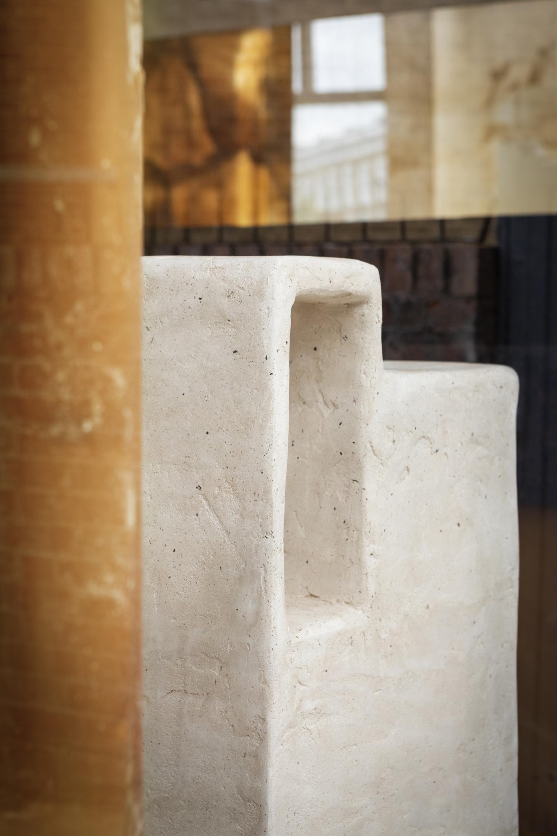 Sculptural installation made from salvaged materials, emphasizing circular design principles in a sustainable store concept.