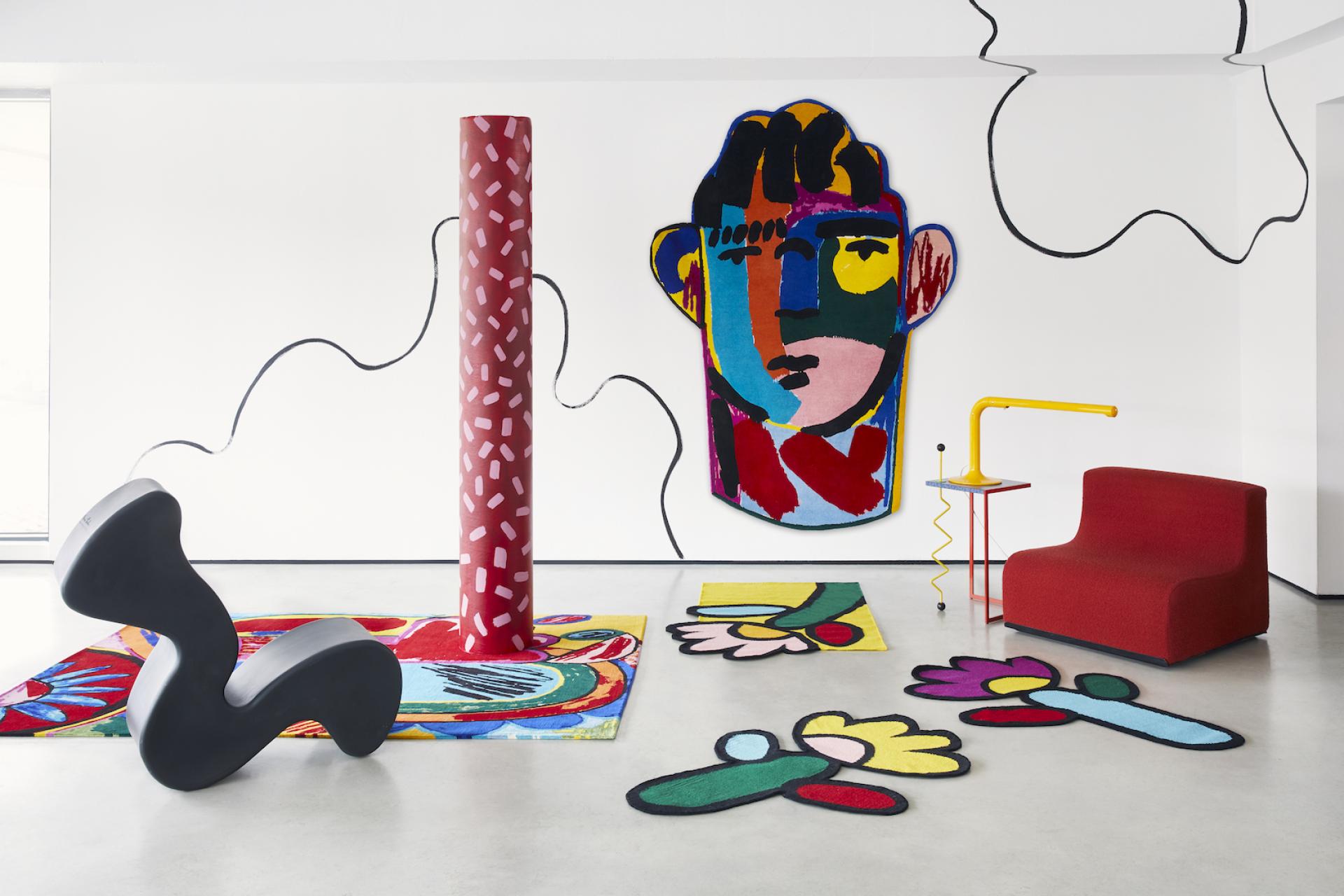 Colorful interior featuring a bold mural, artistic rugs, and modern furniture by artist John Booth for FLOOR_STORY collaboration.