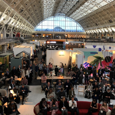 Crowd gathered at the Workspace Design Show, showcasing innovative designs and collaborative environments under the "Destination Workplace" theme.