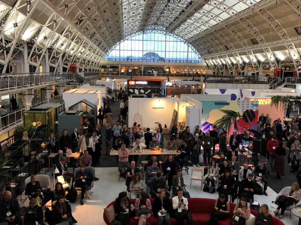 Crowd gathered at the Workspace Design Show, showcasing innovative designs and collaborative environments under the 