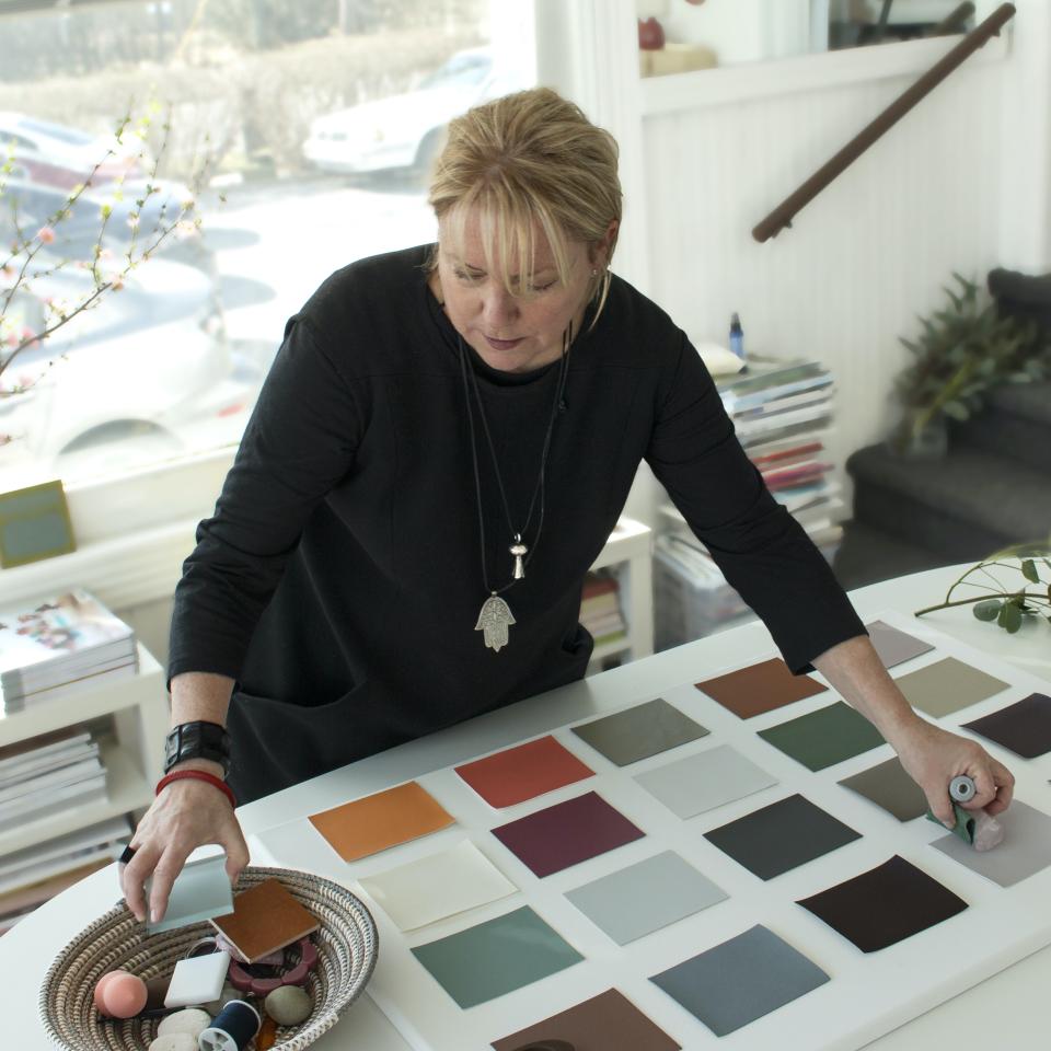 Colour expert arranging a variety of mindful colour swatches for Ultrafabrics' new animal-free fabric collection.