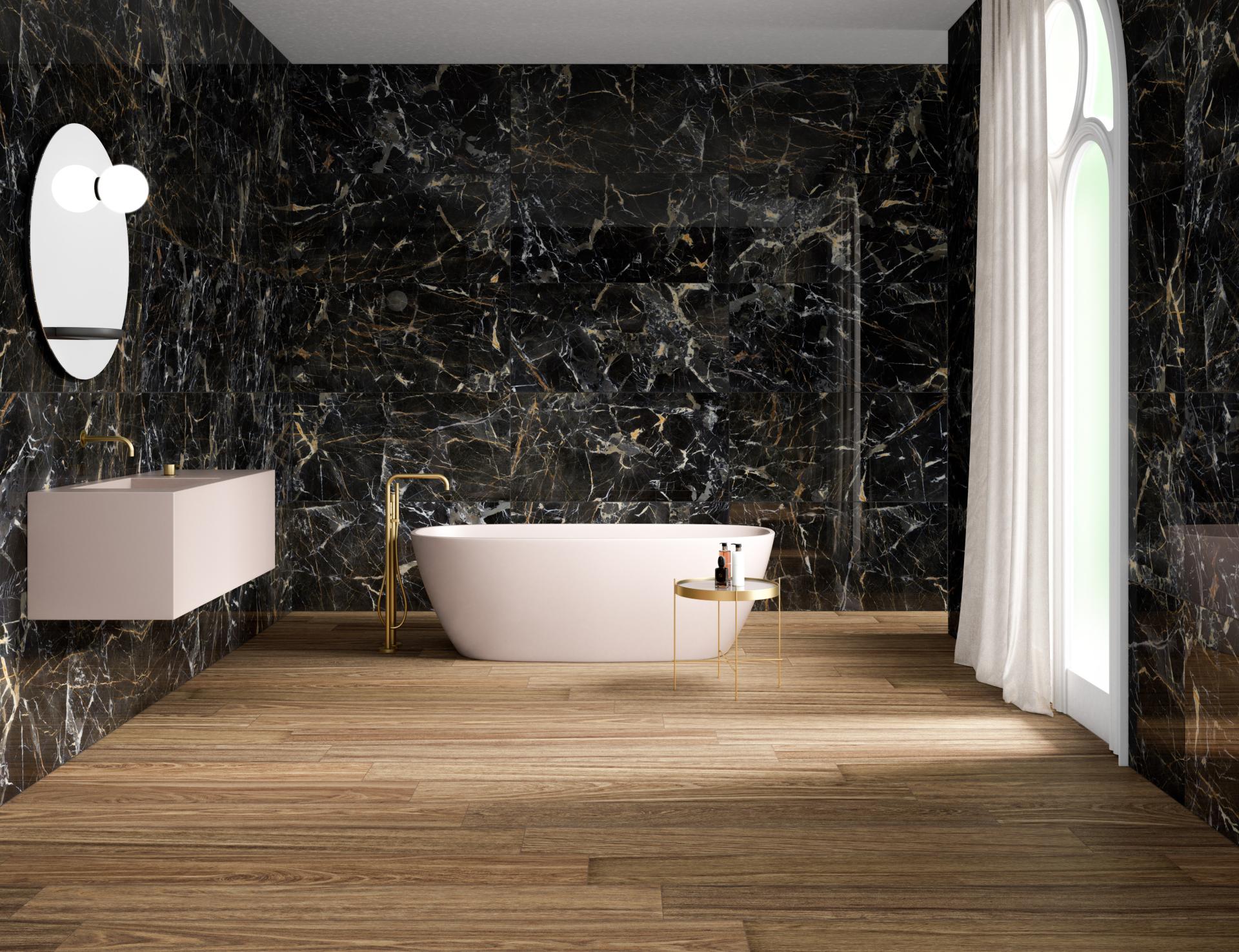 Stylish bathroom featuring black marble walls, wooden flooring, a modern bathtub, and elegant gold accents.