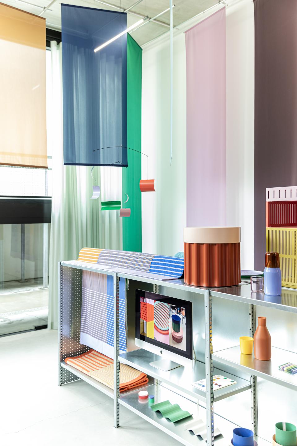 Vibrant display of Dutch design featuring colorful textiles, modern decor, and innovative crafts at Dutch Design Week 2024.