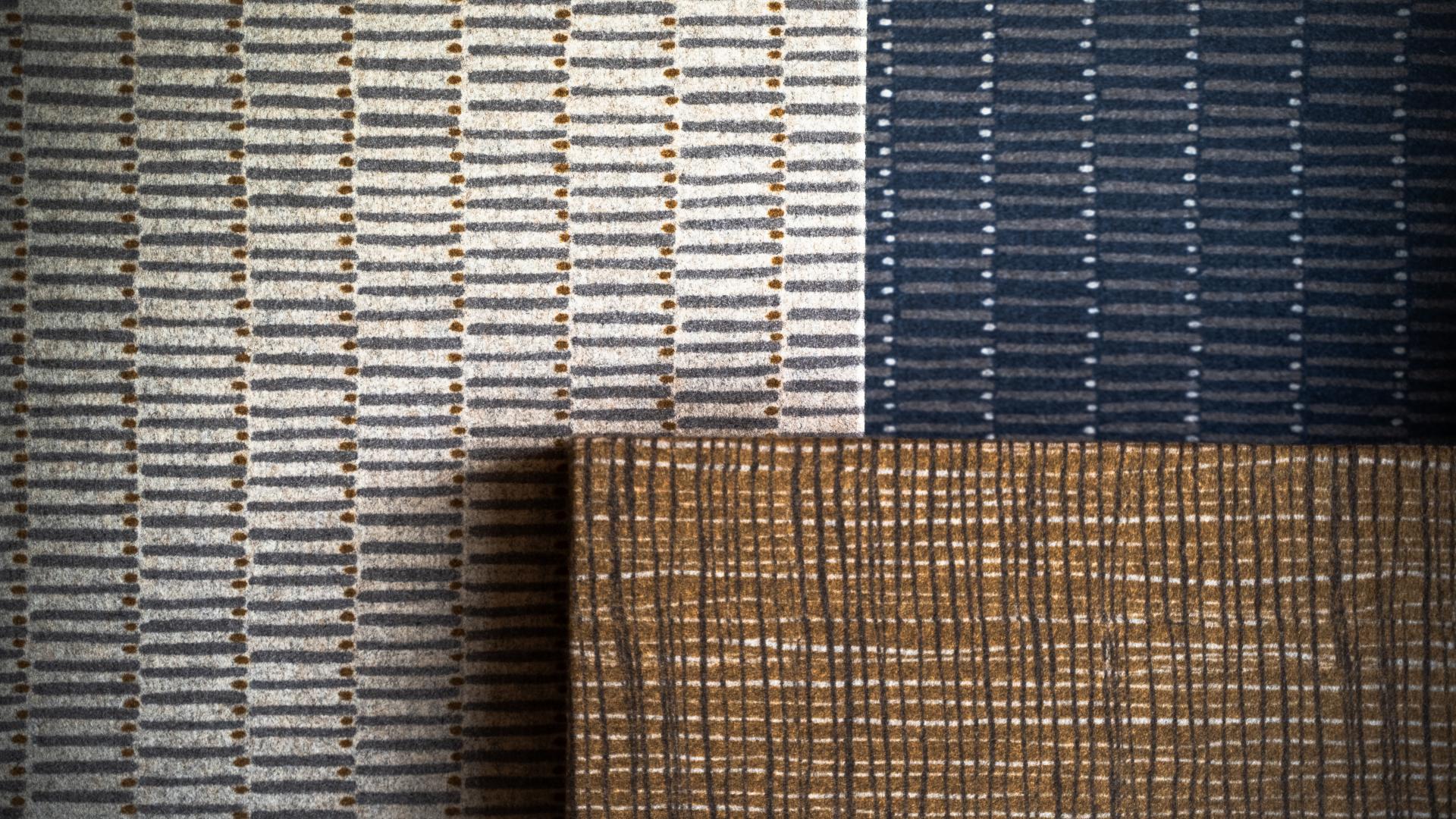 Textured wool fabrics in various colors showcasing Camira's innovative digital printed wool collection.