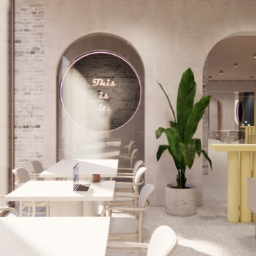 Modern café interior featuring light wood furniture, indoor plants, and a neon sign reading "This is it," embodying current design trends.