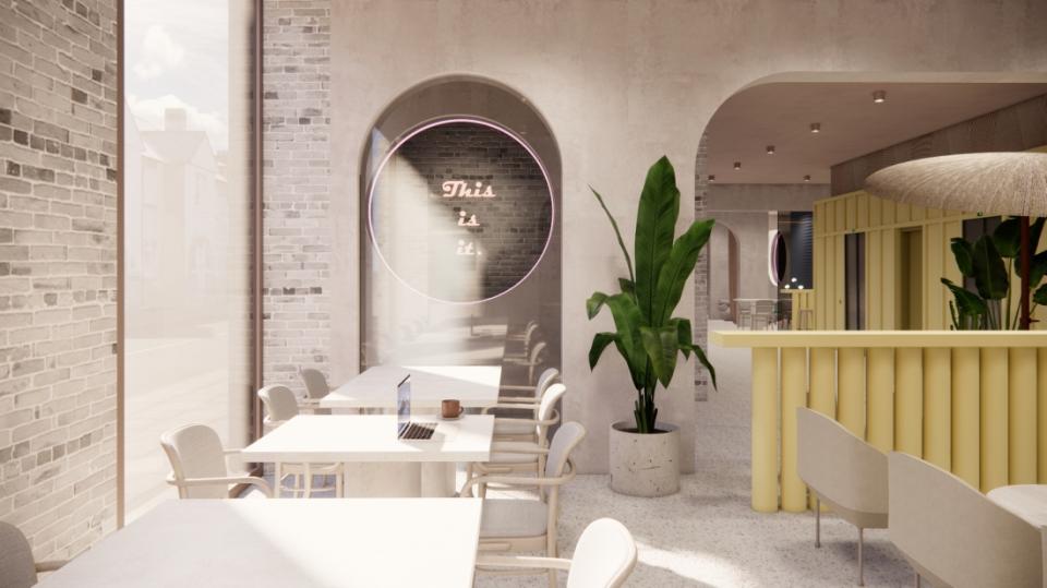 Modern café interior featuring light wood furniture, indoor plants, and a neon sign reading 