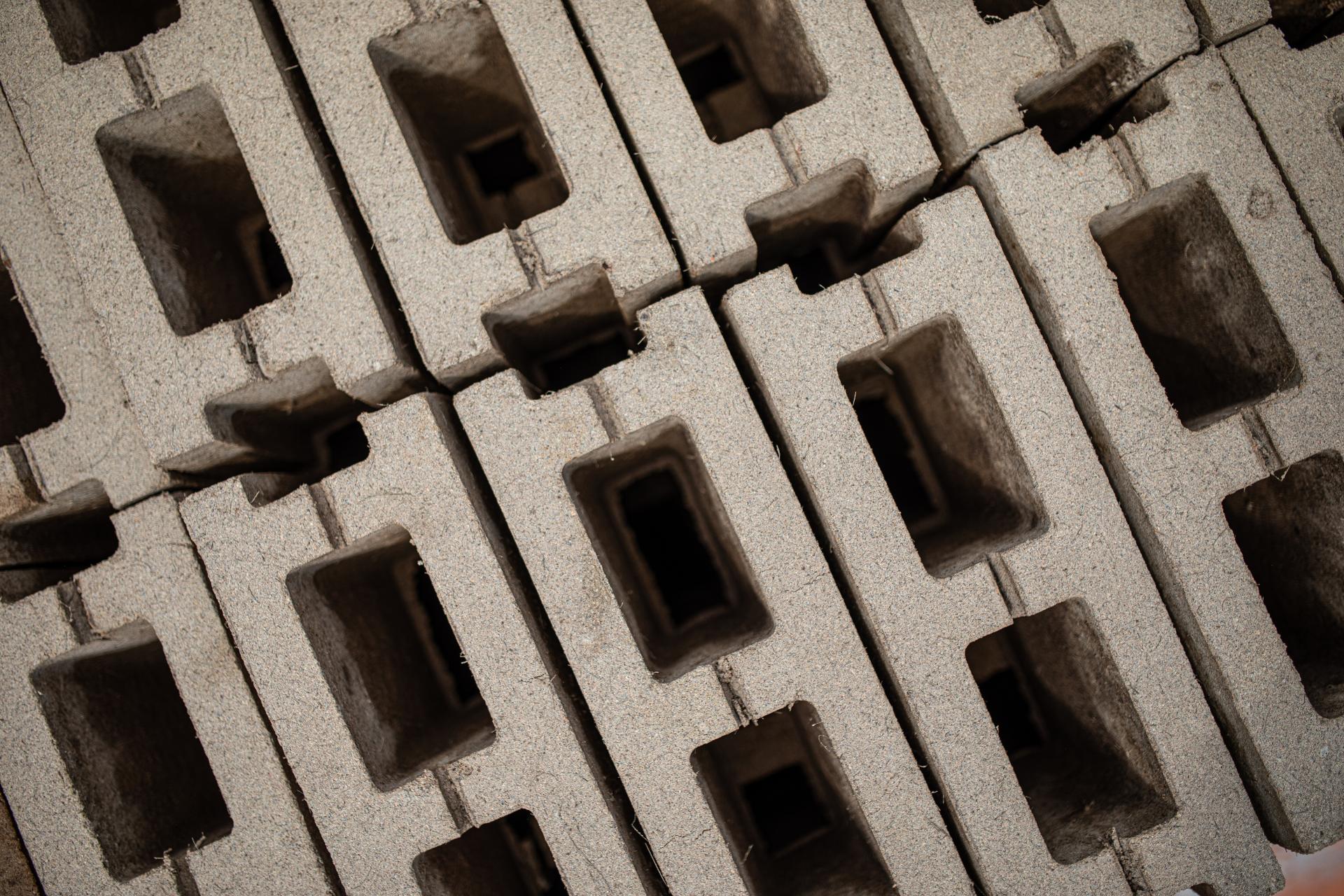 Sustainable concrete blocks arranged in a pattern, highlighting Prometheus Materials' zero-carbon building products.