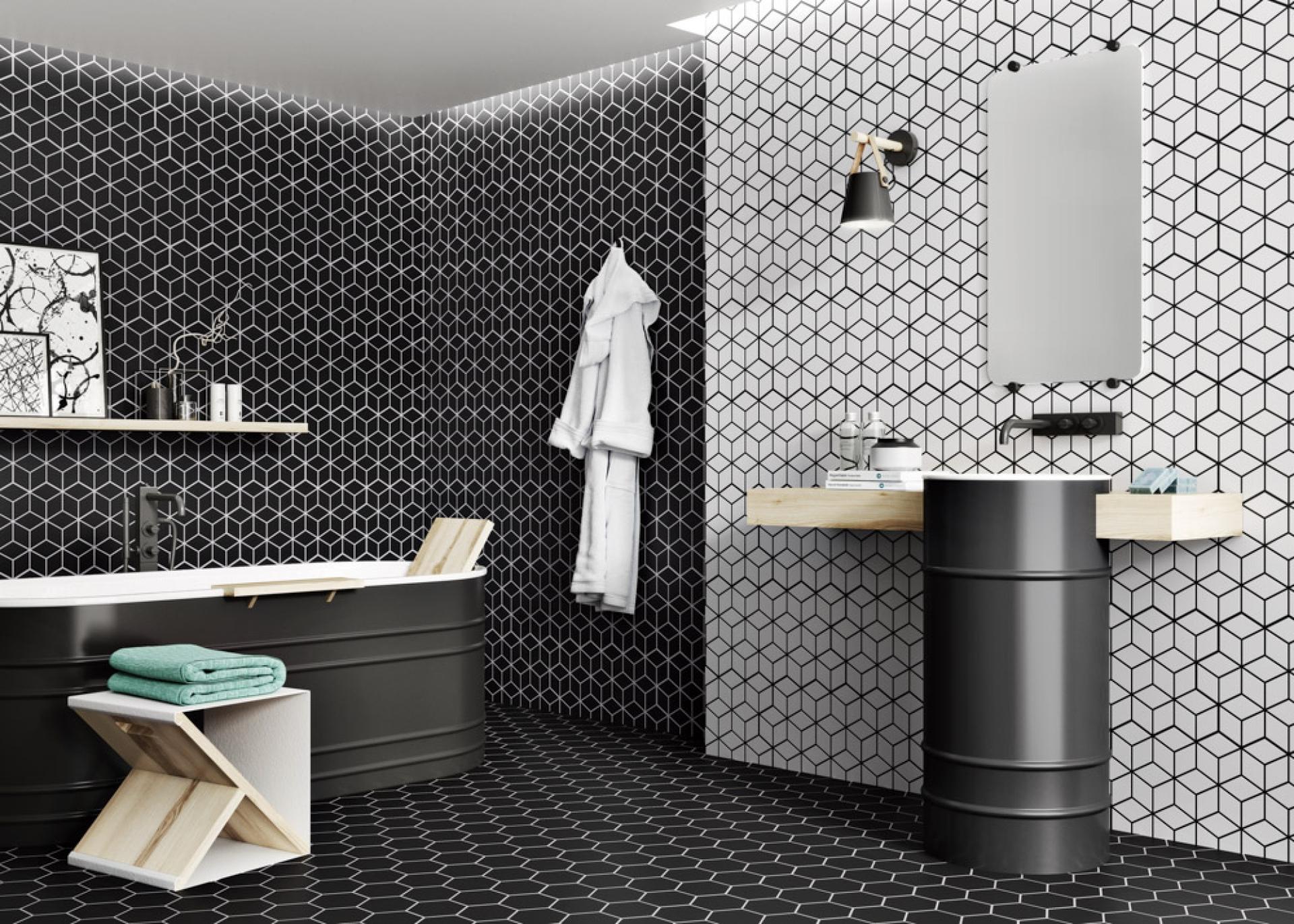 Stylish modern bathroom featuring black and white geometric tile patterns, a freestanding bathtub, and minimalist decor.