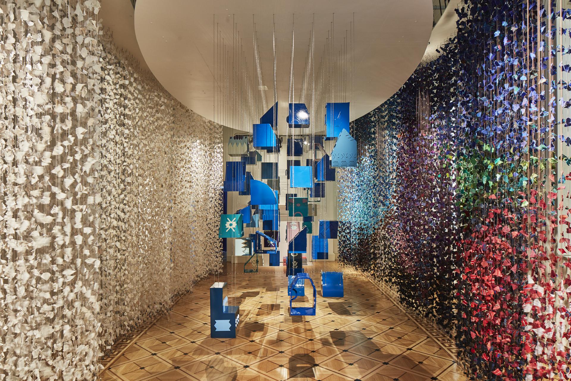 Colorful hanging decorations create an immersive experience at the London Design Biennale, showcasing unique artistic expressions.