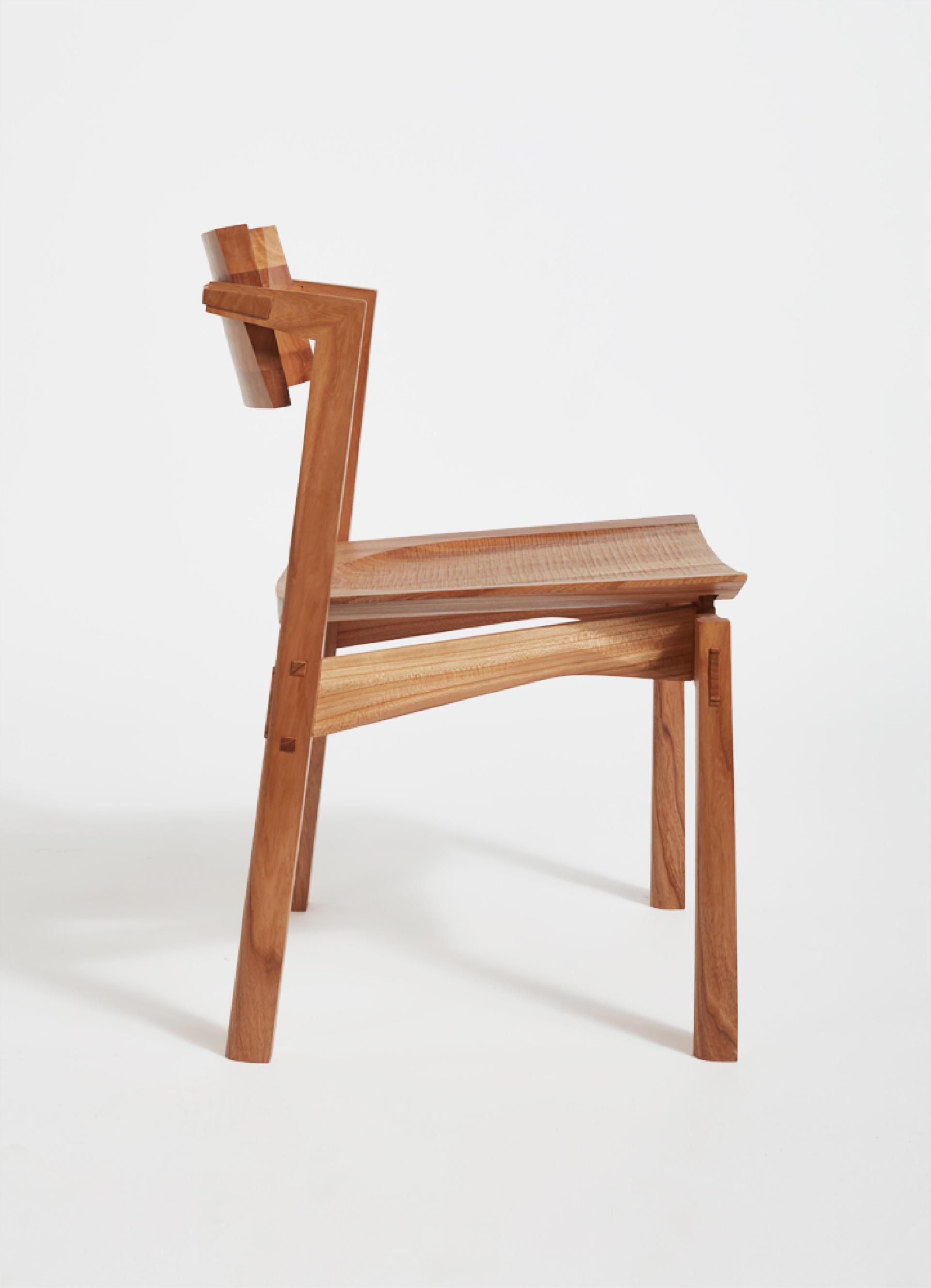 Elegant wooden chair showcasing innovative craft design, highlighting the artistry and creativity in North West England's maker community.