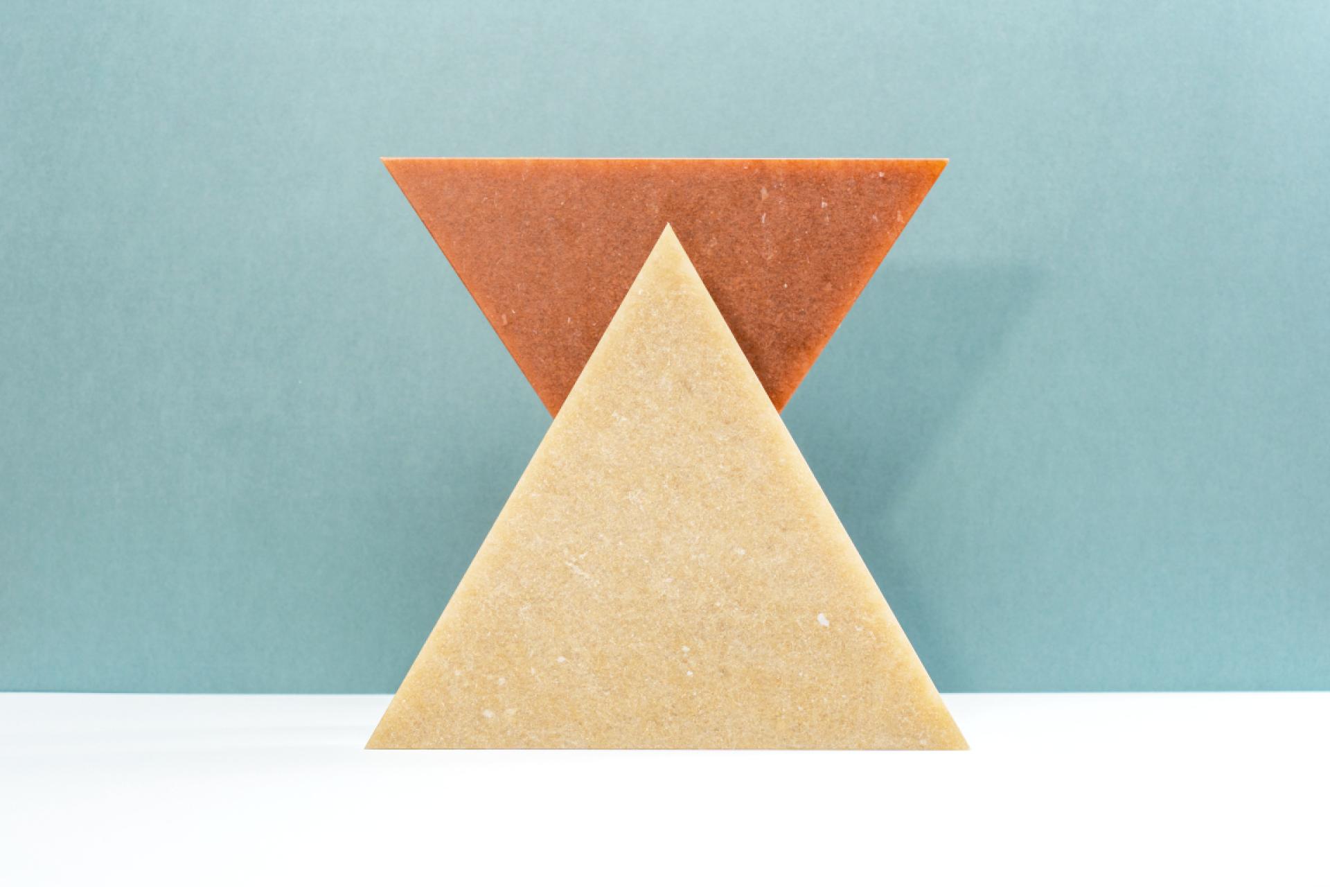 Triangular blocks made from waste-based materials highlight innovative design principles at the Material Matters Fair.