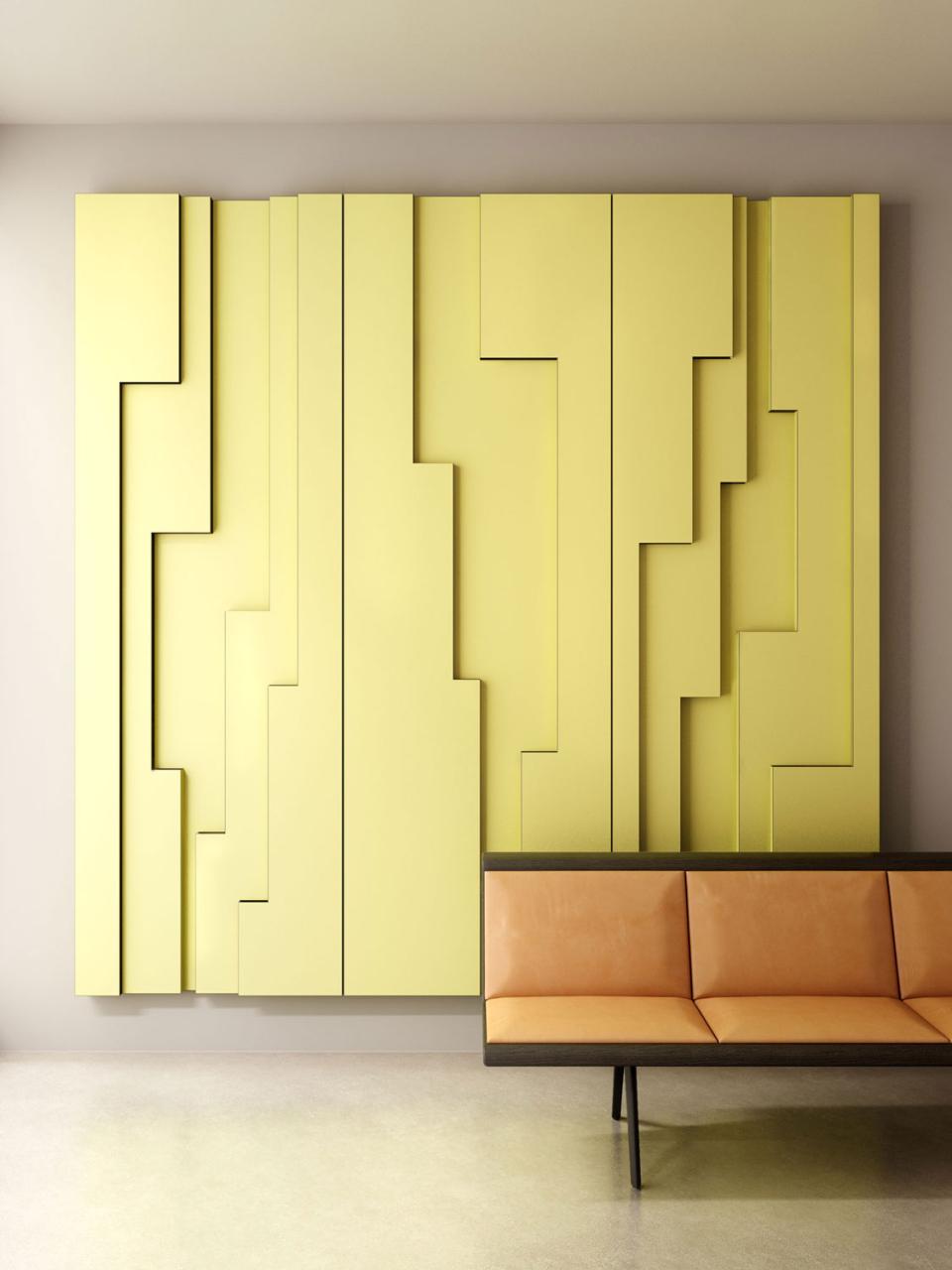 Modern interior featuring a vibrant yellow Fold Panel wall design, complemented by a sleek orange seating area.