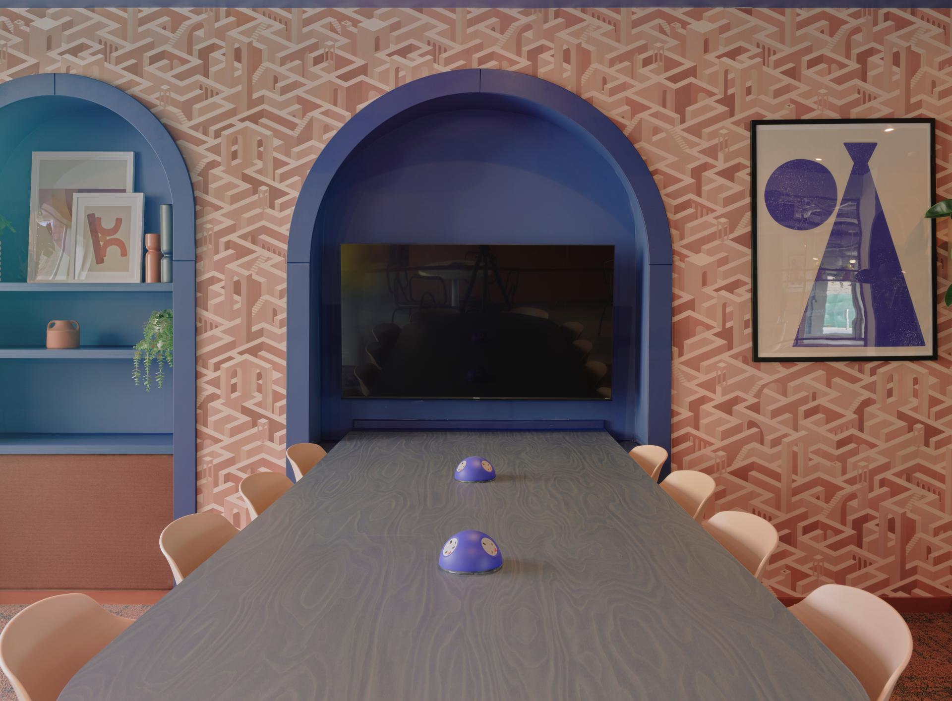 Modern meeting room at Enso, showcasing vibrant decor and technology, reflecting Colchester's artistic essence and innovative design.