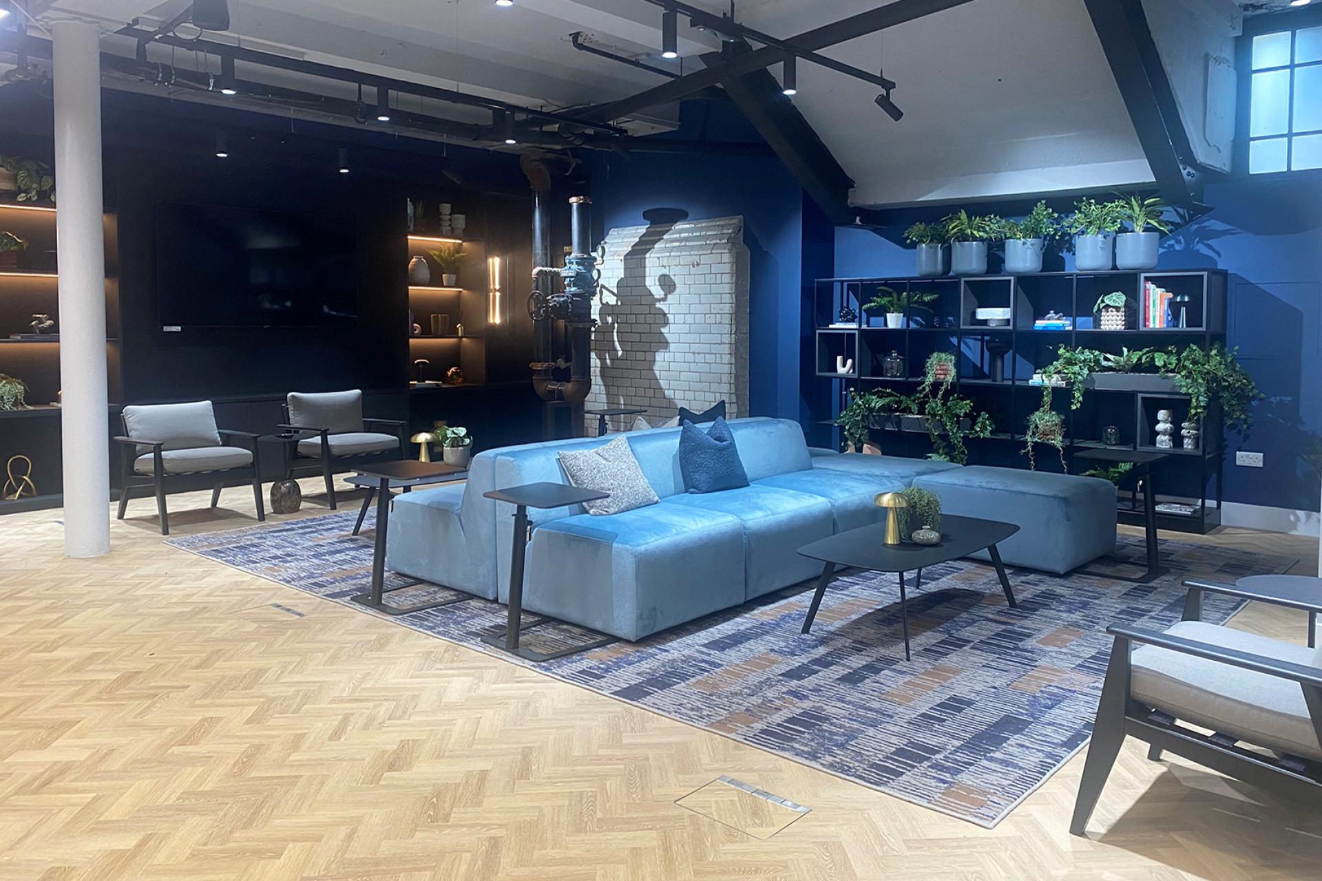 Bespoke rug design showcased in a stylish lounge area within the refurbished Sevendale House, highlighting its industrial heritage.