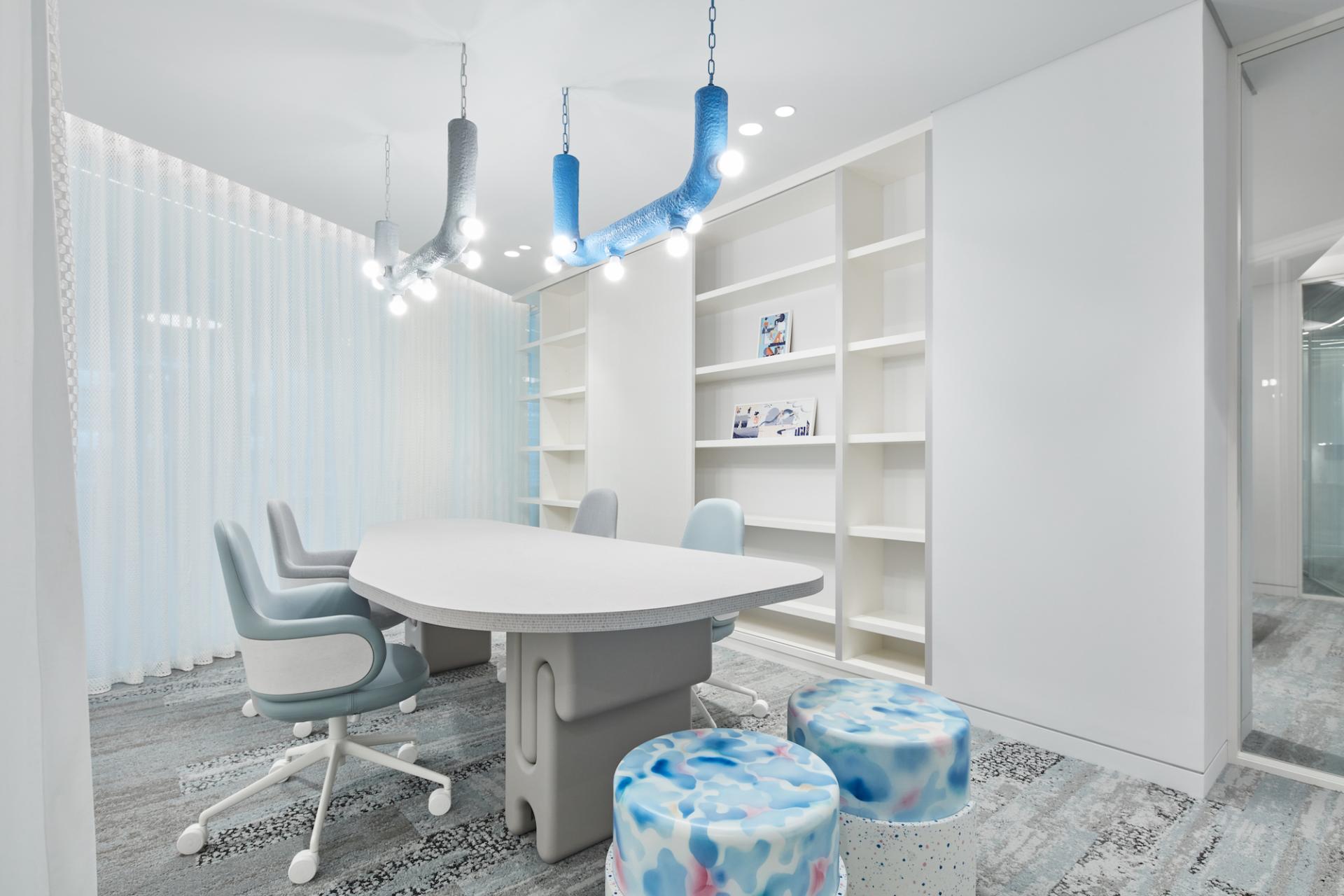 Bright, modern meeting room designed by Roar Studio featuring playful decor and functional furniture for the Early Childhood Authority.