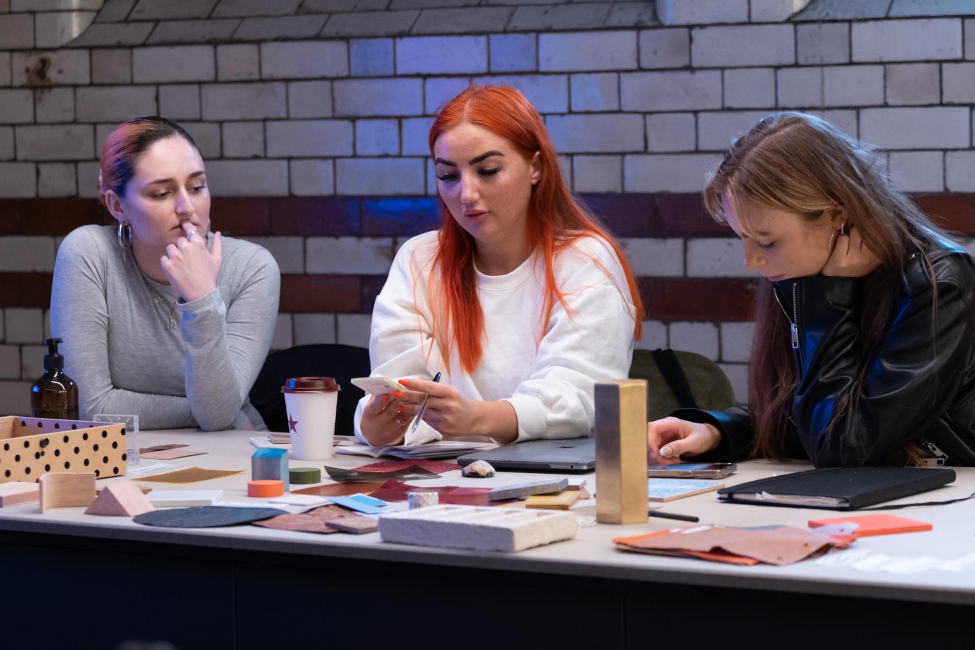 Students engage in a workshop, exploring color theory and material textures at Manchester Metropolitan University's School of Art.