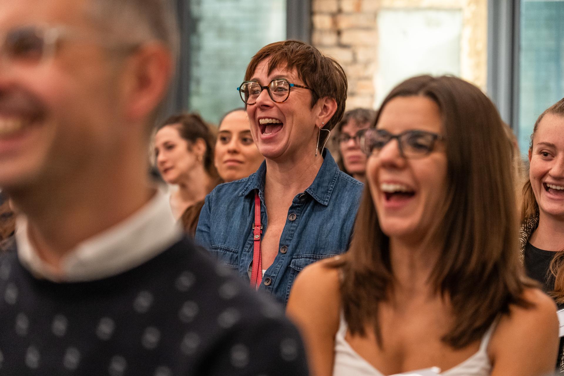 Audience enjoying a lively event at Material Source Studio, highlighting engagement and collaboration in the modern workplace.