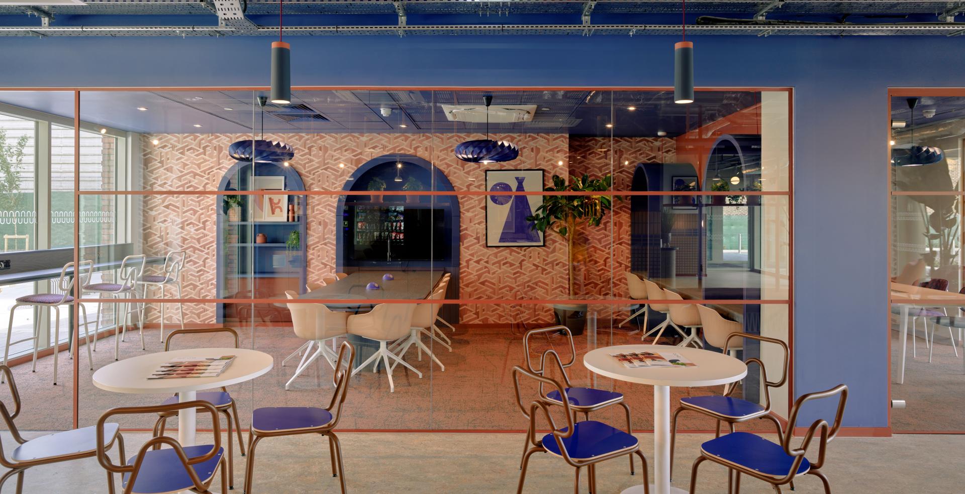 Modern collaborative workspace in Enso, showcasing vibrant design elements, seating areas, and connection to Colchester's heritage.