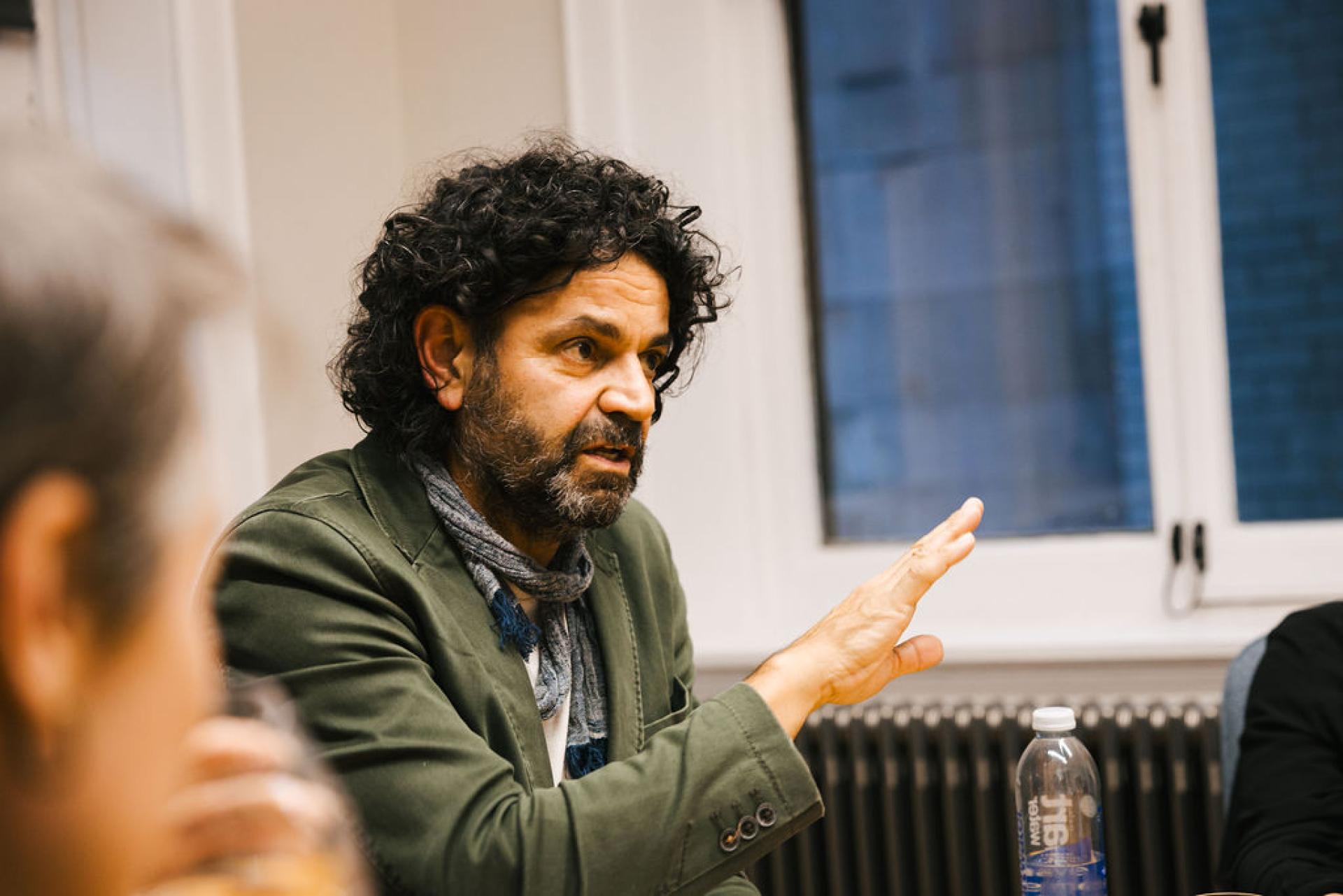 Discussion on Glasgow's property market, featuring a speaker passionately addressing participants during a seminar event.