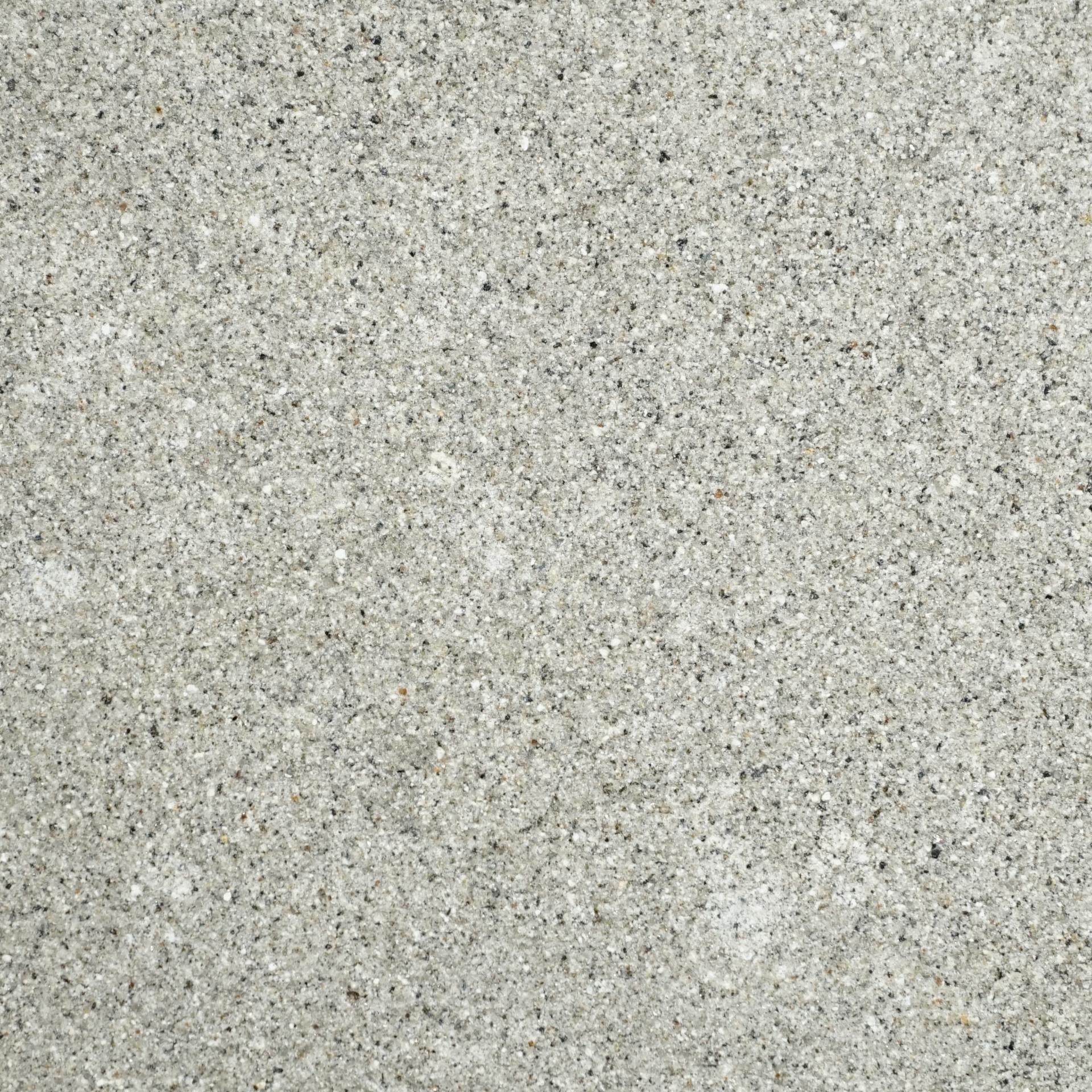 Close-up of textured light gray surface, featuring fine grains, relevant to DeakinBio's materials exploration in the maker in residence program.