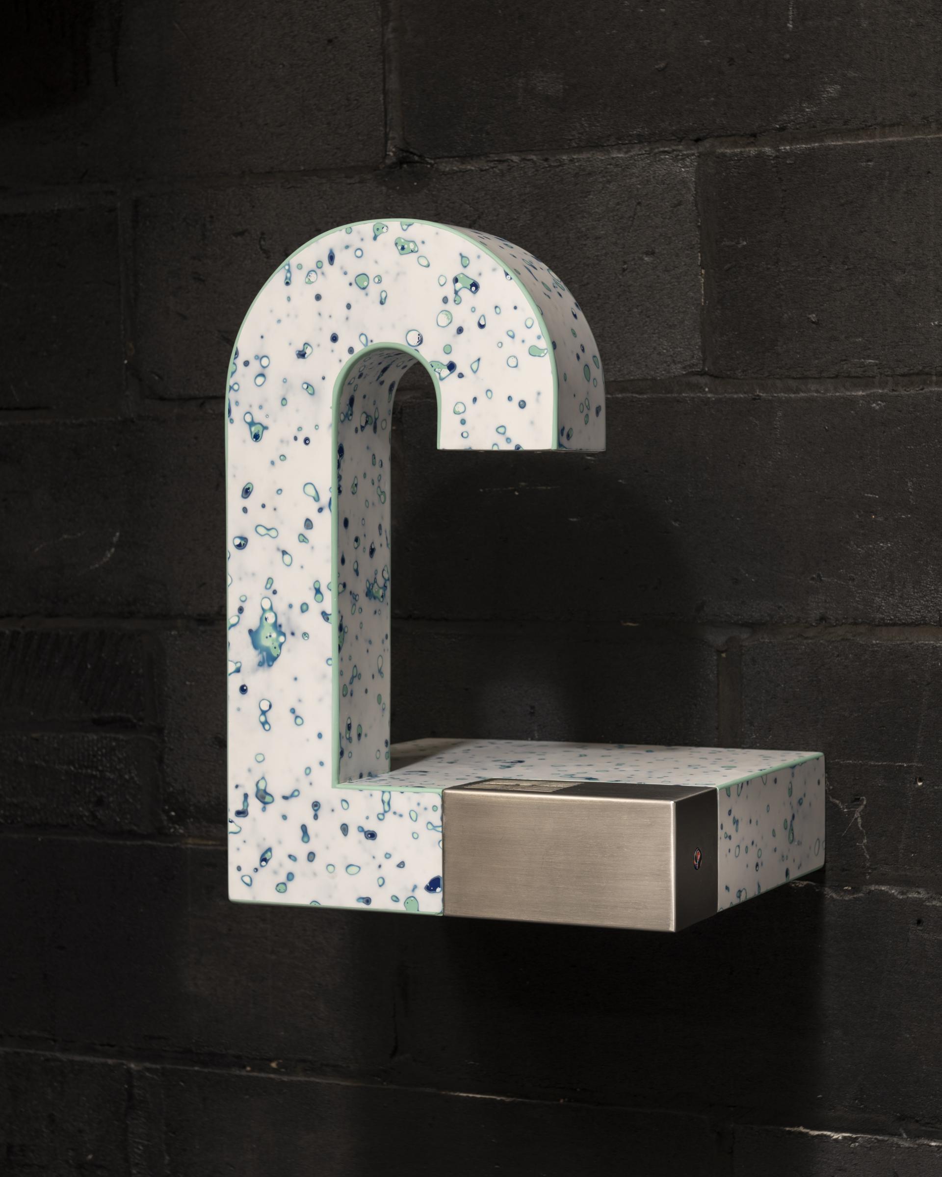 Unique surface design element featuring speckled blue and white material, highlighting Mirrl's innovative approach to design inspiration.