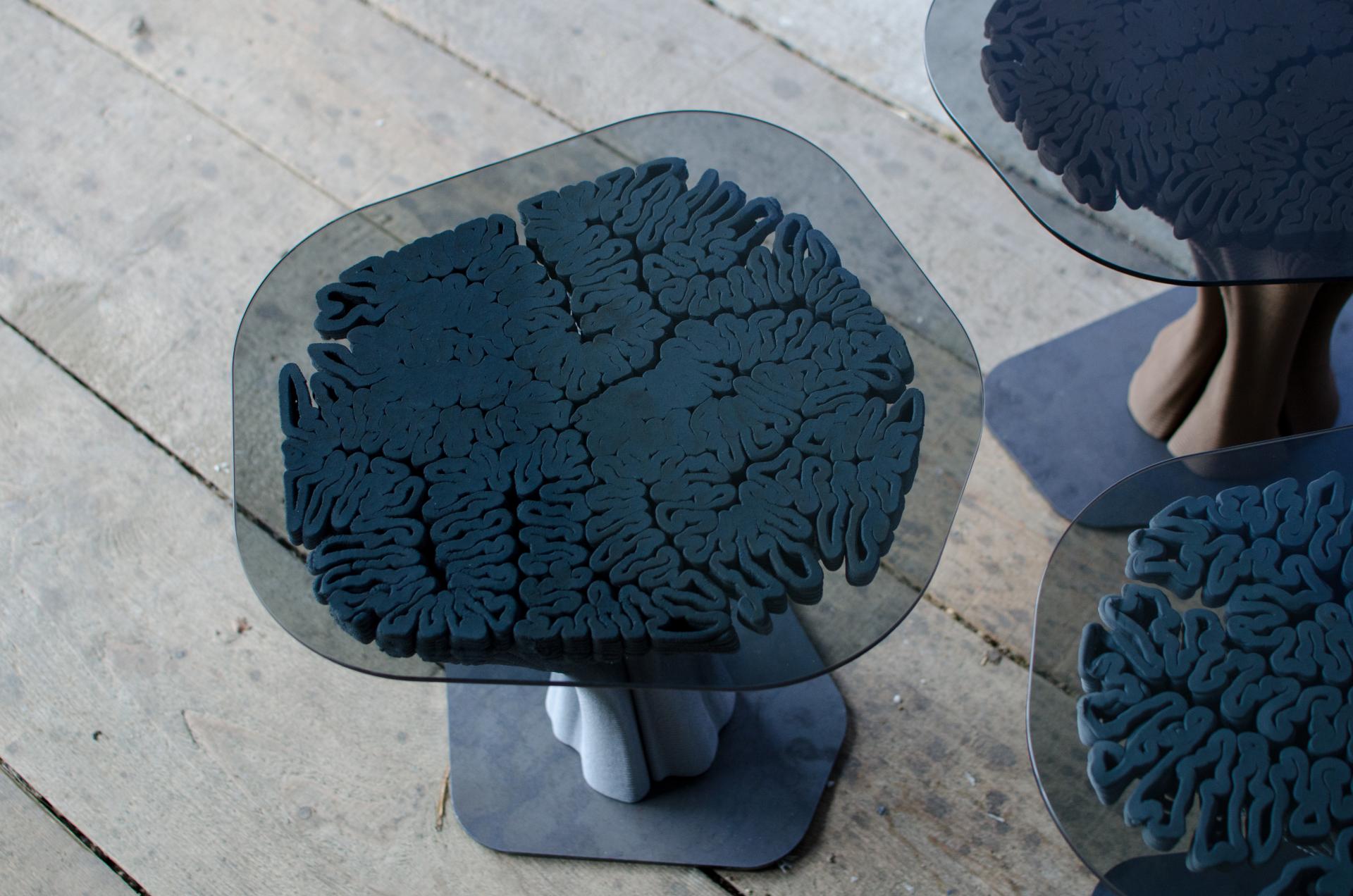 Unique 3D-printed table with organic, brain-like design, showcasing innovative design in contemporary furniture.