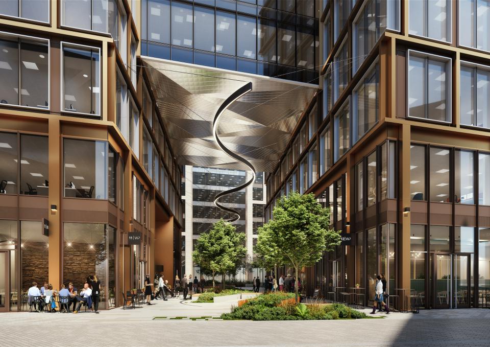 Modern urban plaza with greenery, sustainable design elements, and outdoor seating at TP Bennett’s 11 & 12 Wellington Place.