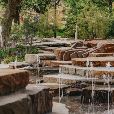 Natural stone steps and water features create a tranquil landscape at Elephant Springs in Central London.