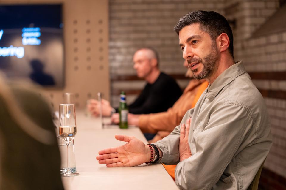 Participants engage in a roundtable discussion about sustainability and value engineering, highlighting collaboration and innovative solutions.
