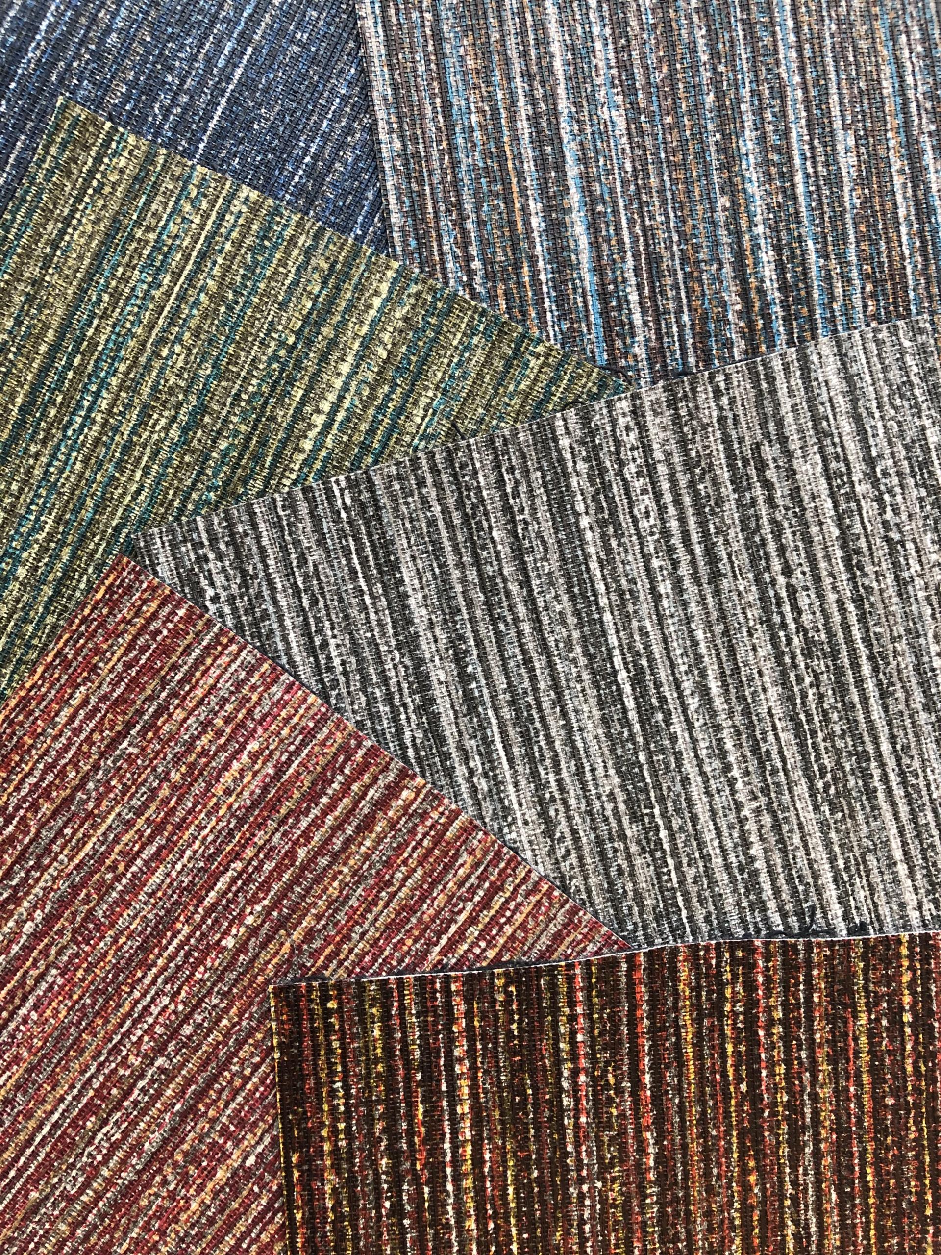 Textured upholstery fabric samples in various colors, showcasing Agua's innovative design and quality for performance upholstery.
