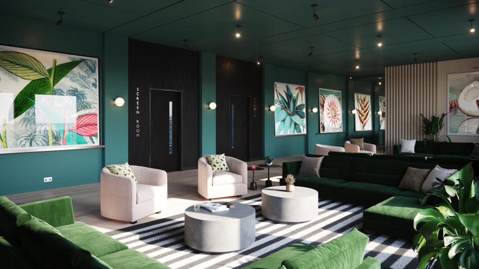 Modern lounge area in Holland Park, featuring green sofas and vibrant artwork, designed for community living in Glasgow.