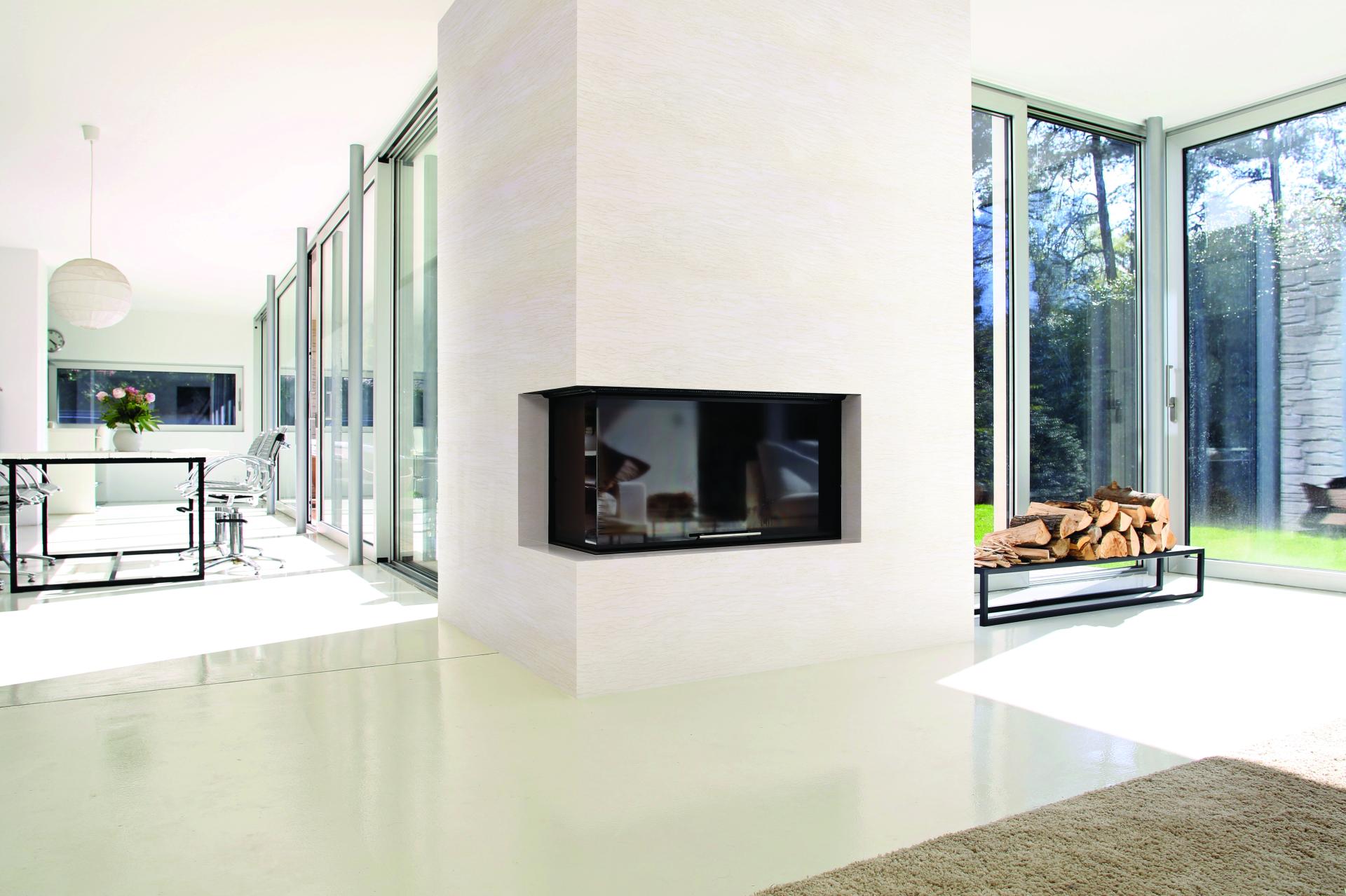 Modern living space featuring a sleek fireplace, large glass windows, and minimalist decor, showcasing Hanex® Solid Surface applications.