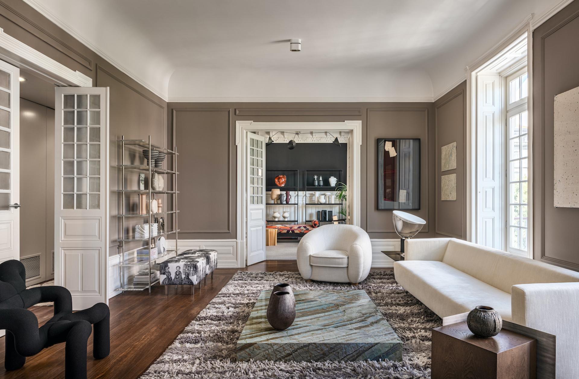 Luxurious living room featuring Cristina Jorge de Carvalho's modern furniture designs, including a stylish sofa and coffee table.