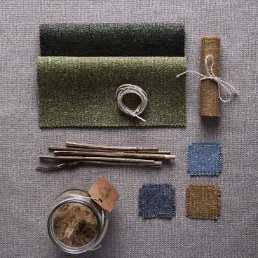 Fabric samples and natural materials showcasing Camira's ten-year celebration of sustainable Hemp collection.