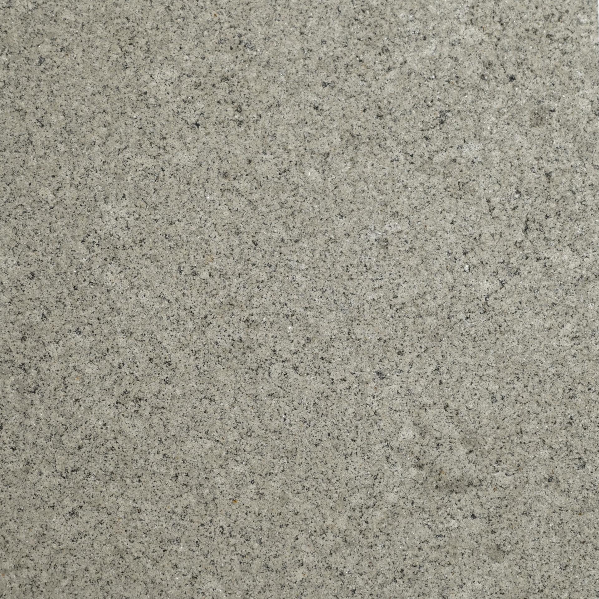 Granite surface texture featuring a blend of gray tones and black speckles, highlighting material diversity in DeakinBio's maker space.