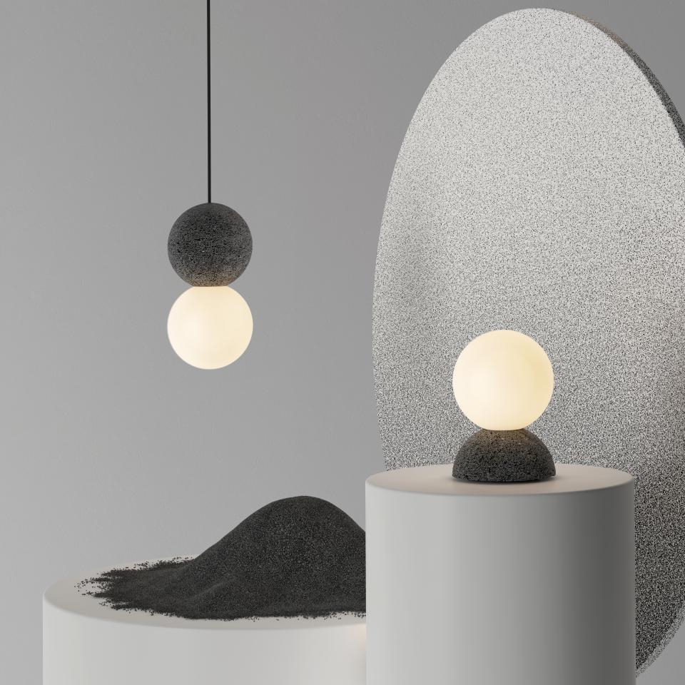 Sleek pendant and table lamps from studio davidpompa's Origo collection showcased at Design Week Mexico, featuring contrasting materials and shapes.