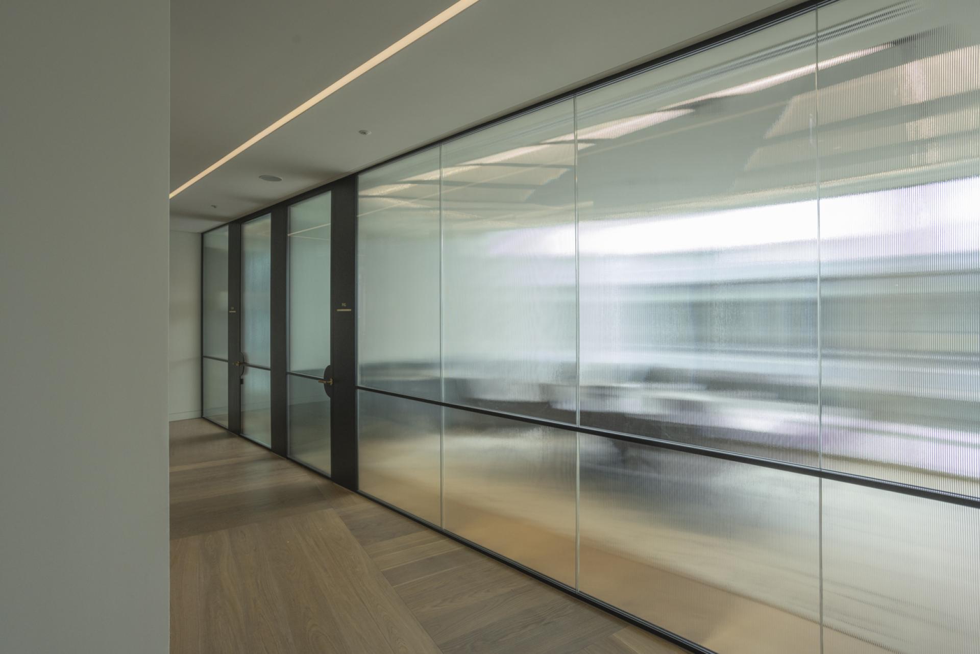 Bespoke door designs and high-end office partitions by Radii for Goodwin Procter.