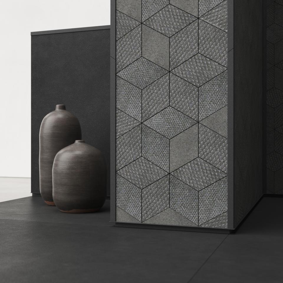 Contemporary interior design featuring Mutina's textured tile wall and elegant ceramic vases by OEO Studio.