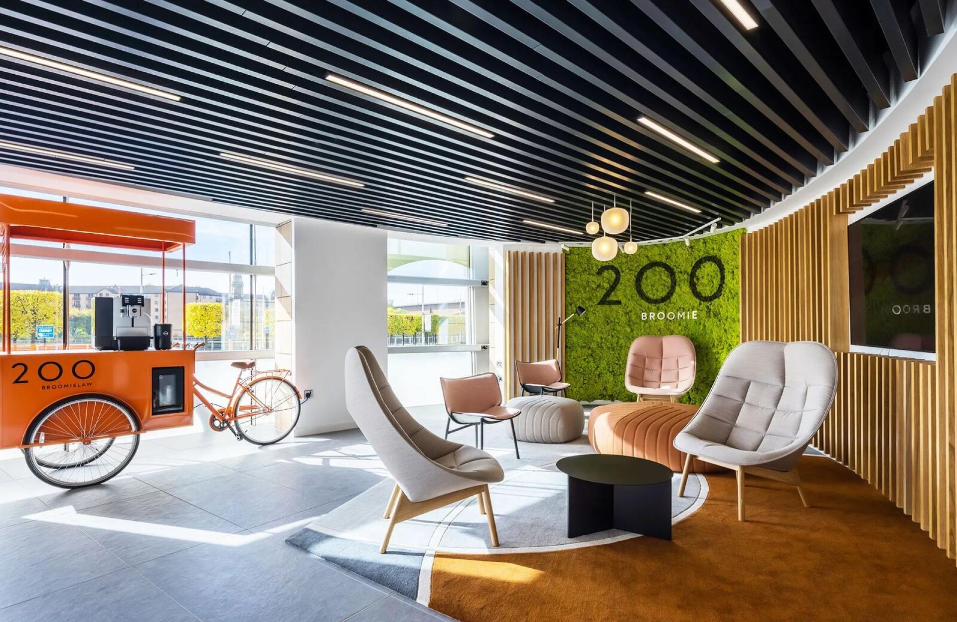 Modern interior with biophilic design elements, including a green wall and stylish seating area in Scotland.