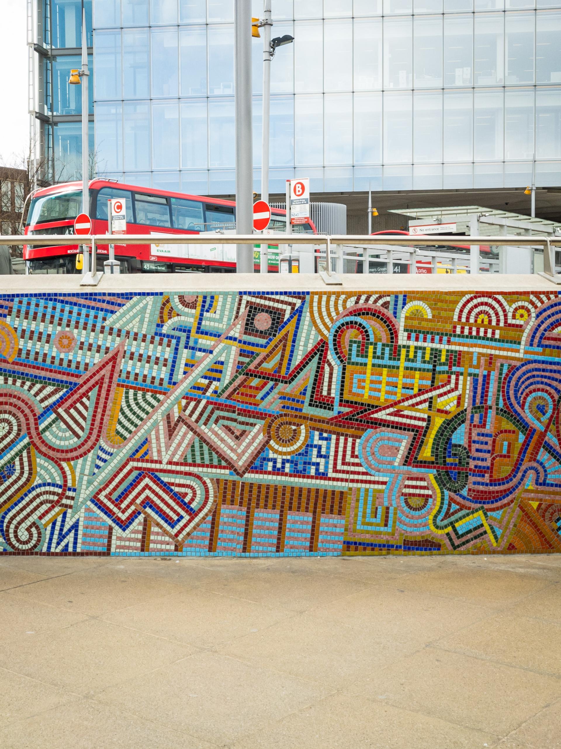 Vibrant mosaic artwork showcasing geometric patterns and colors, celebrating community and traditional crafts in urban design.