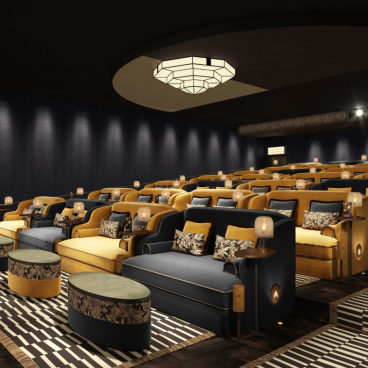 Luxurious seating arrangement in the stylish boutique cinema TIVOLI, featuring vibrant colors and elegant decor.
