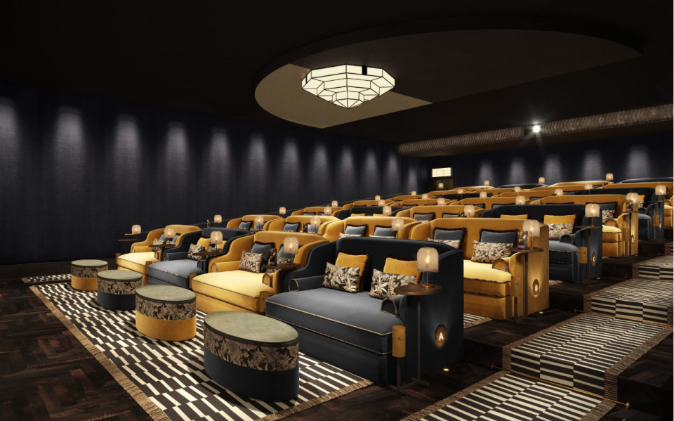 Luxurious seating arrangement in the stylish boutique cinema TIVOLI, featuring vibrant colors and elegant decor.