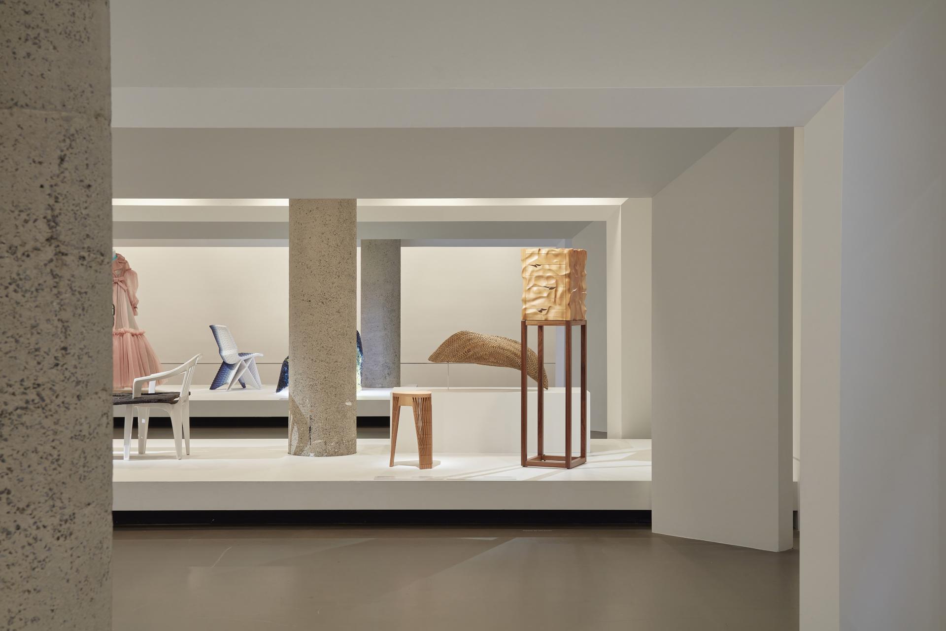 Exhibition space at the National Gallery of Victoria showcasing diverse artworks made from various materials, including timber and synthetics.