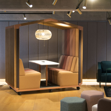 Modern soft seating pod by sixteen3, featuring cozy booths and a stylish pendant light, designed for collaborative workspaces.